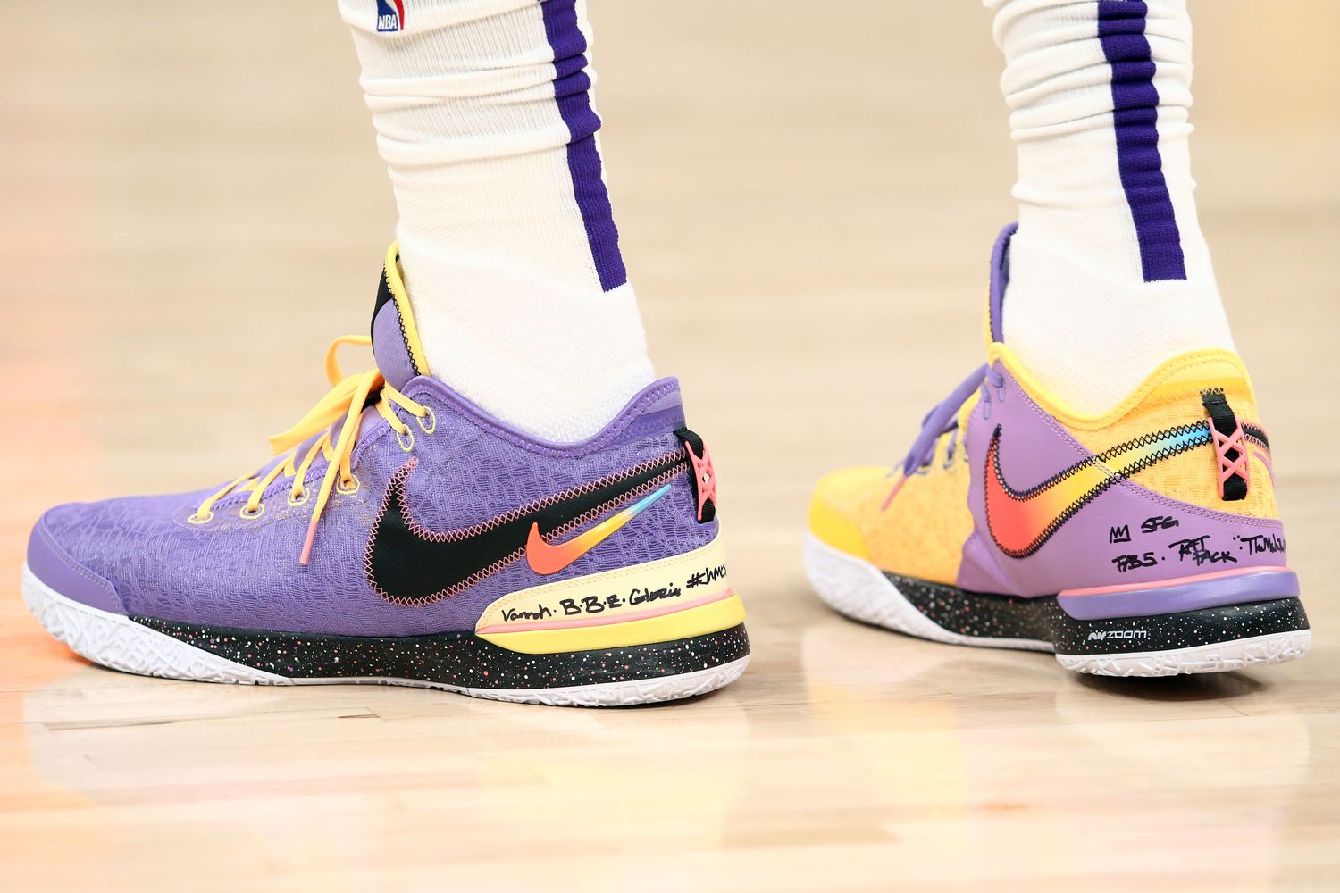 View of LeBron James' purple and gold Nike shoes.